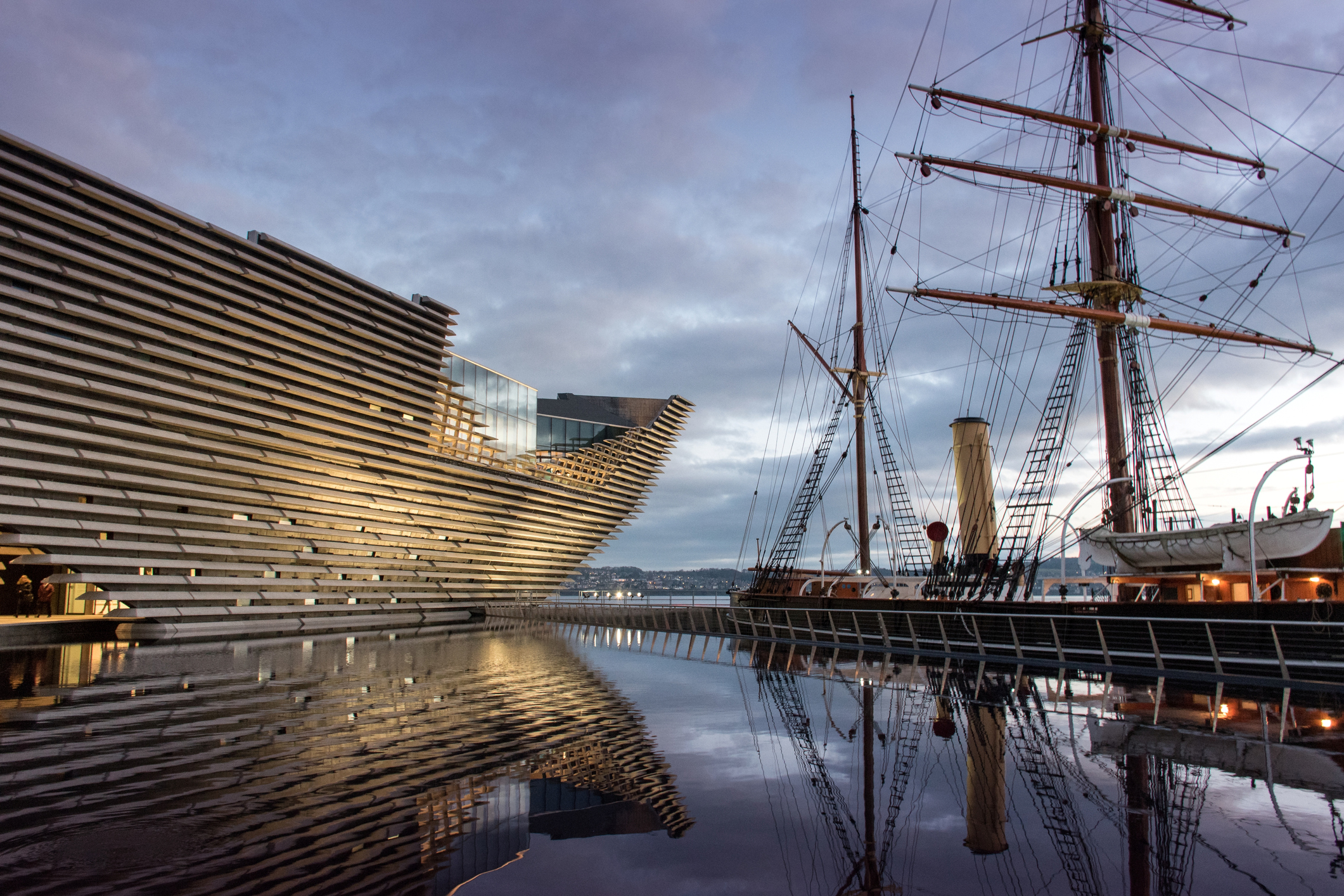 Dundee, Scotland-27 December 2018: Victoria &Albert Museum Dundee exhibition opening Ocean Liners, Scottish Design museum exterior and ship at dusk